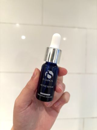 Mica Ricketts holding iS Clinical Active Serum