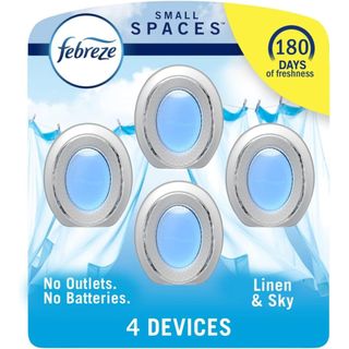 Febreze Small Space air freshener multipack with four blue-liquid filled white plastic diffuser cones