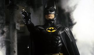 Batman Michael Keaton ready to fire a grappling gun