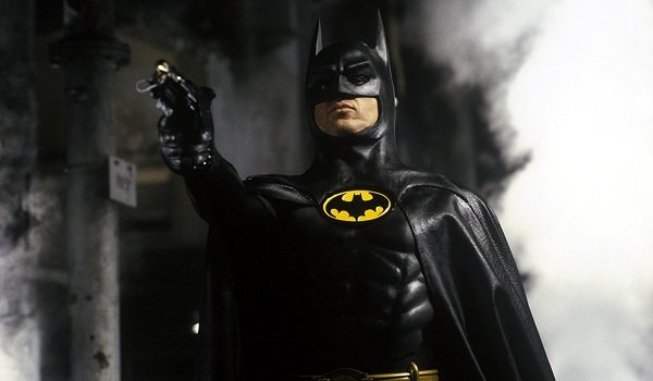 Batman Michael Keaton ready to fire a grappling gun