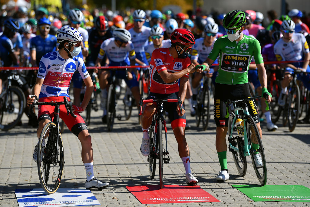 AGUILAR DE CAMPOO SPAIN OCTOBER 29 Start Guillaume Martin of France and Team Cofidis Solutions Credits Polka Dot Mountain Jersey Richard Carapaz of Ecuador and Team INEOS Grenadiers Red Leader Jersey Primoz Roglic of Slovenia and Team Jumbo Visma Green Points Jersey Social distancing Peloton Cid Campeador Military Base Castrillo del Val Team Presentation during the 75th Tour of Spain 2020 Stage 9 a 1577km stage from Cid Campeador Military Base Castrillo del Val to Aguilar de Campoo lavuelta LaVuelta20 on October 29 2020 in Aguilar de Campoo Spain Photo by Justin SetterfieldGetty Images