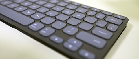 The Logitech Keys-To-Go 2 keyboard sitting on a light-green table.