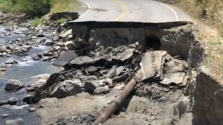 Road destroyed by floodwater at Yellowstone National Park