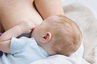 Breastfeeding guide woman newborn baby