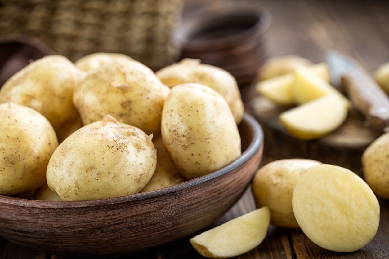 Table And Bowl Full Of White Potatoes