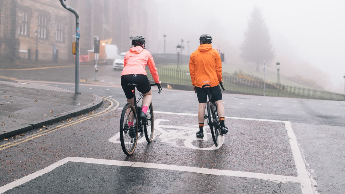 Two commuters at traffic lights in Edinburgh