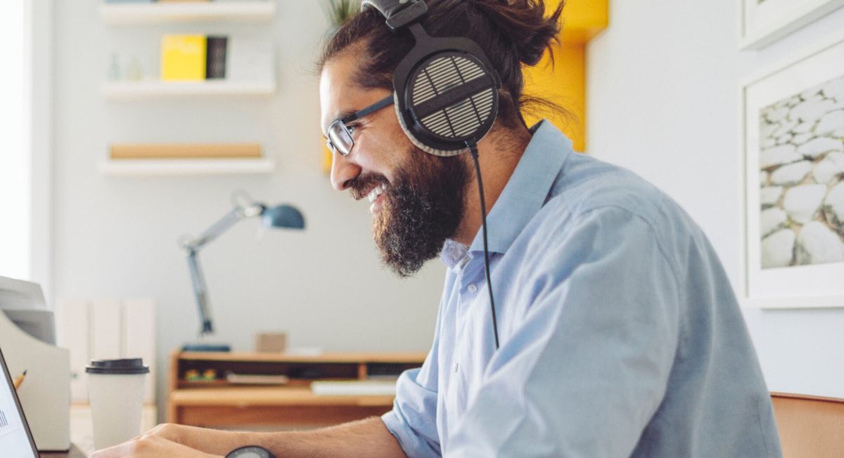 man wearing headphones using microsoft teams