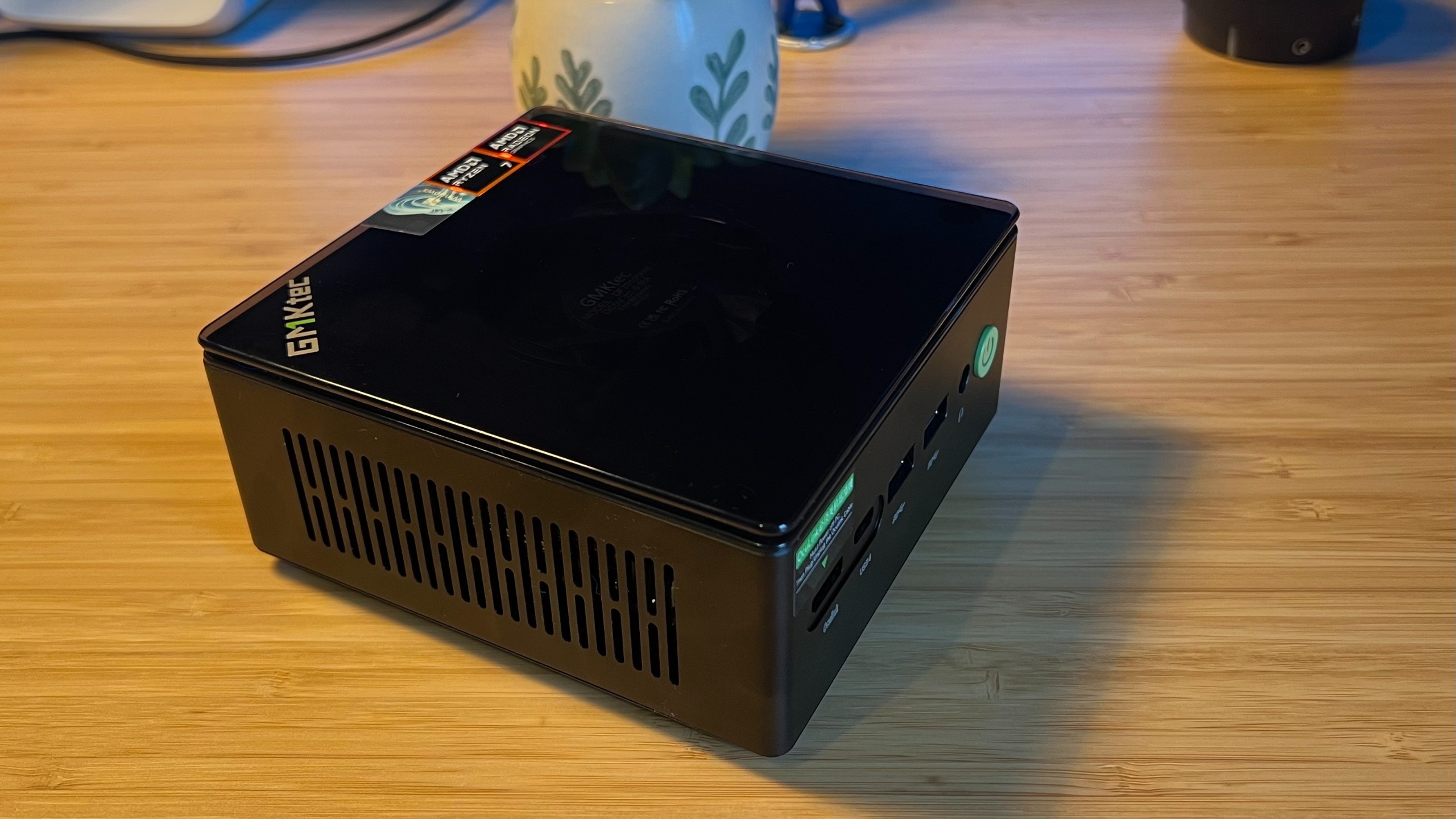 GMKTec K8 Plus mini PC on a wooden desk