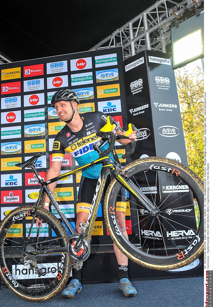 Bart Wellens gets ready to hang up his bike on the Ruddervoorde podium