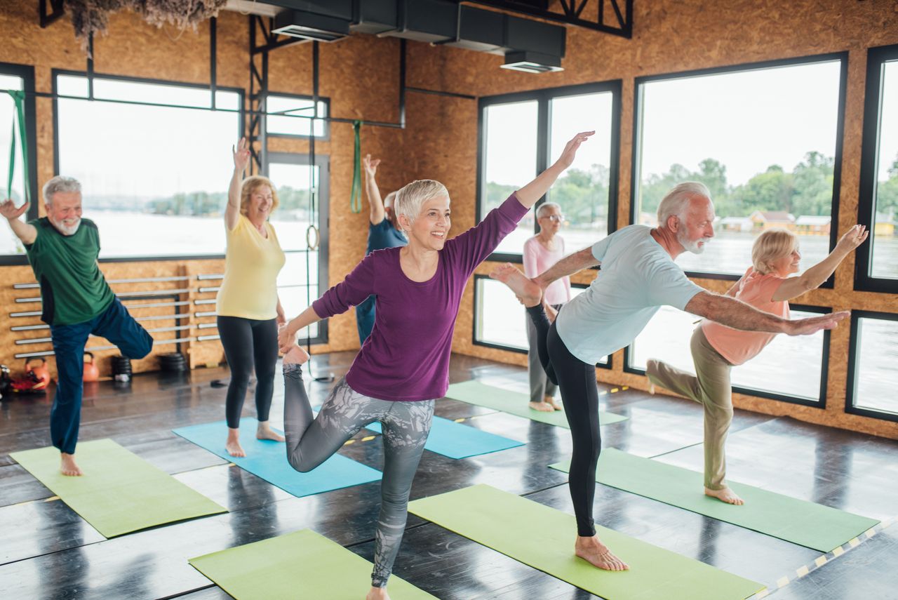 Retirees in a yoga class 