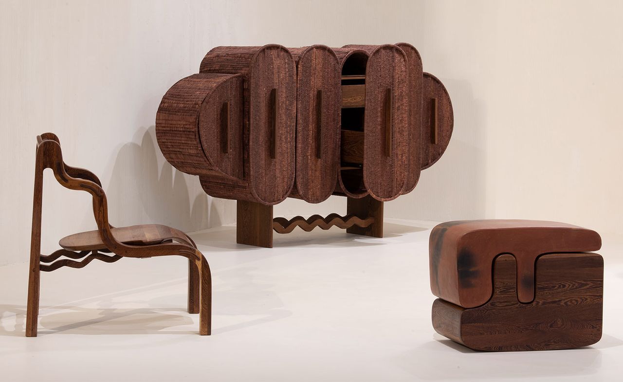 View of three pieces of furniture made of wood by Peter Mabeo for Fendi: a chair, a cabinet and a double stool