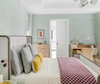 Pale blue bedroom with large bed