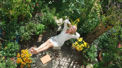 A woman relaxing in a garden