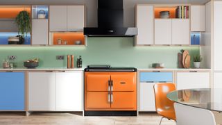 orange AGA ranyburn cooker in blue and white modern kitchen