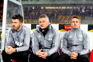 Ole Gunnar Solskjaer alongside coaches Michael Carrick and Kieran McKenna in Manchester United's last match before the lockdown in Austria