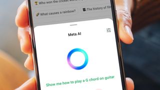 Two hands holding a phone showing WhatsApp's new Meta AI ring