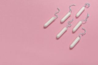 Heavy periods: Group Of Tampons Seen From A High Angle View On A Pink Background With Space For Copy