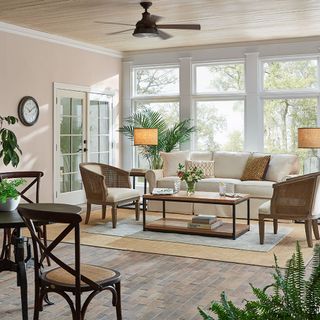 Bright and airy sunroom with furniture and plants
