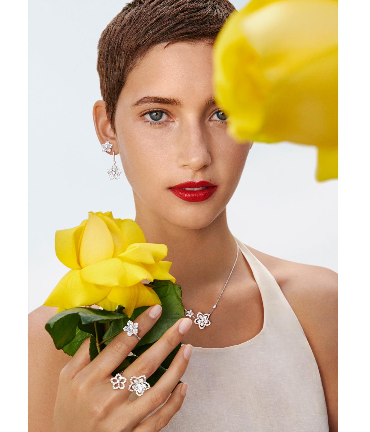 Woman holding yellow flowers