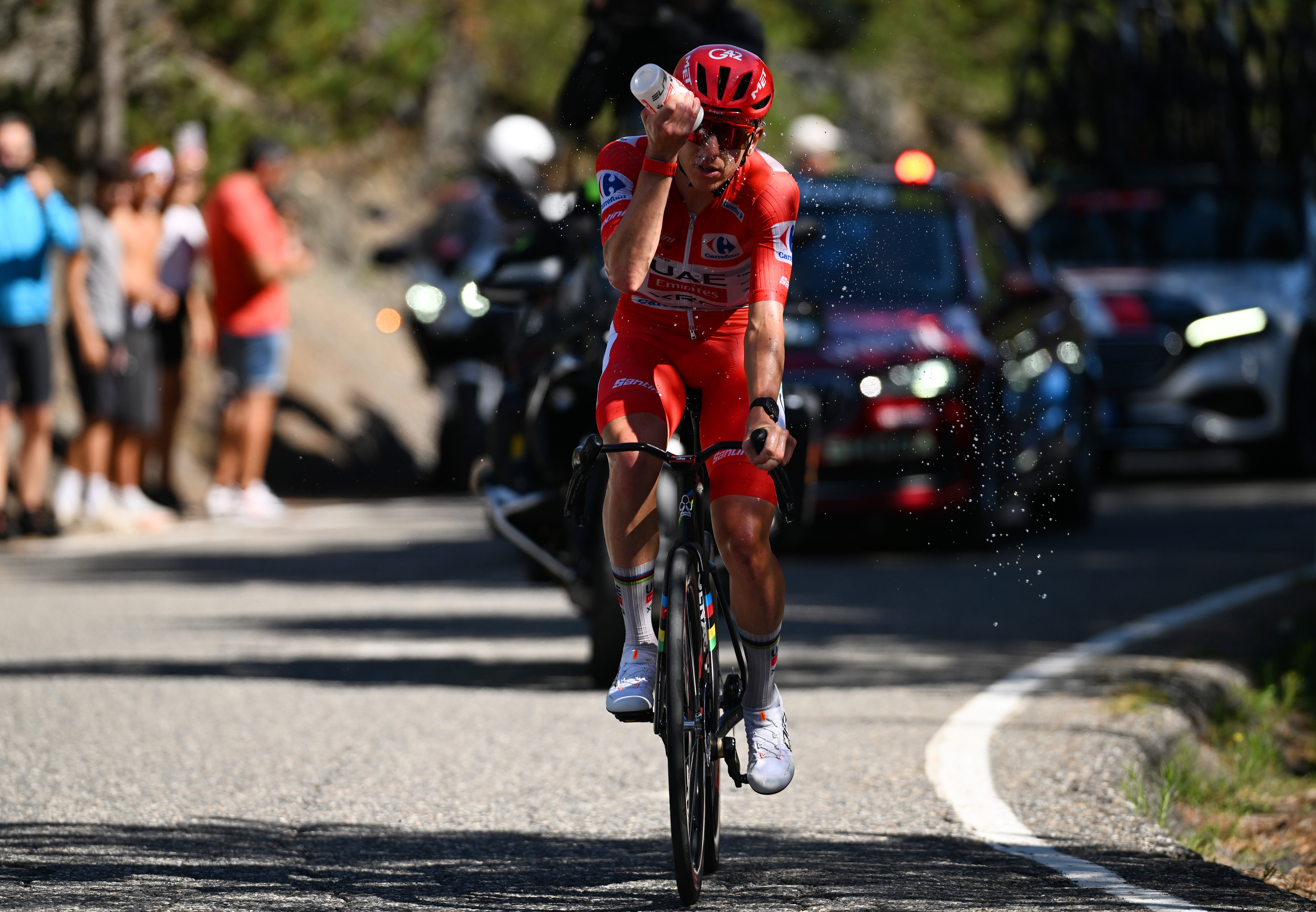 Tadej Pogacar cools down by pouring a bottle of water over himself during stage 4 of the 2026 Vuelta a Espa&amp;ntilde;a (Photo by Tim de Waele/Getty Images)