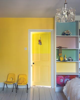 Colourful playroom with storage in bright shades by Farrow & Ball