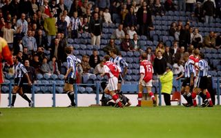 Sheffield Wednesday's Paolo Di Canio walks off the pitch after he is sent off and pushes referee Paul Alcock to the ground in a game against Arsenal in September 1998.
