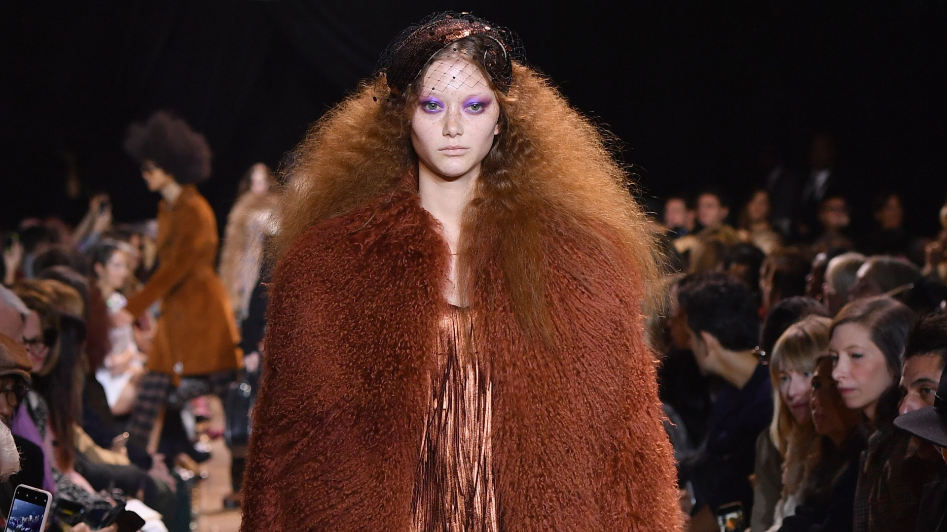 a model wearing a fur coat from michael kors at new york fashion week