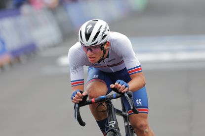 Jed Smithson riding a bike in the junior road race at the 2022 UCI World Championships