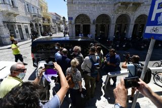 Journalists and photographers gathered in front of a van used to transport Harry Maguire away from court on Saturday