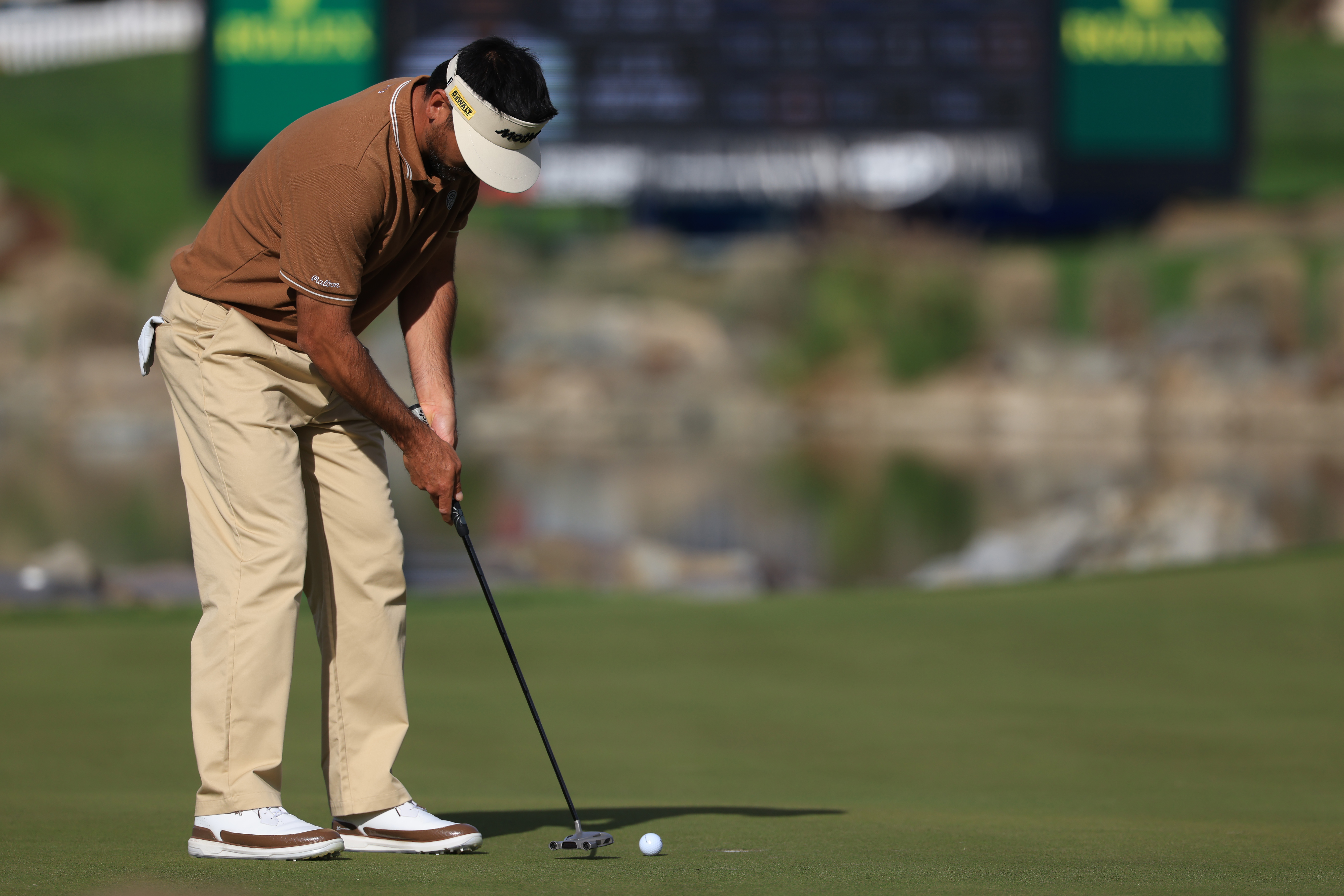 Jason Day hits a putt