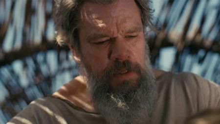 Matt Damon looking distressed, with a long gray beard in The Odyssey