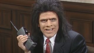 Phil Hartman using a phone as Unfrozen Cave Man Lawyer on SNL.