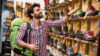 A man shopping for hiking boots