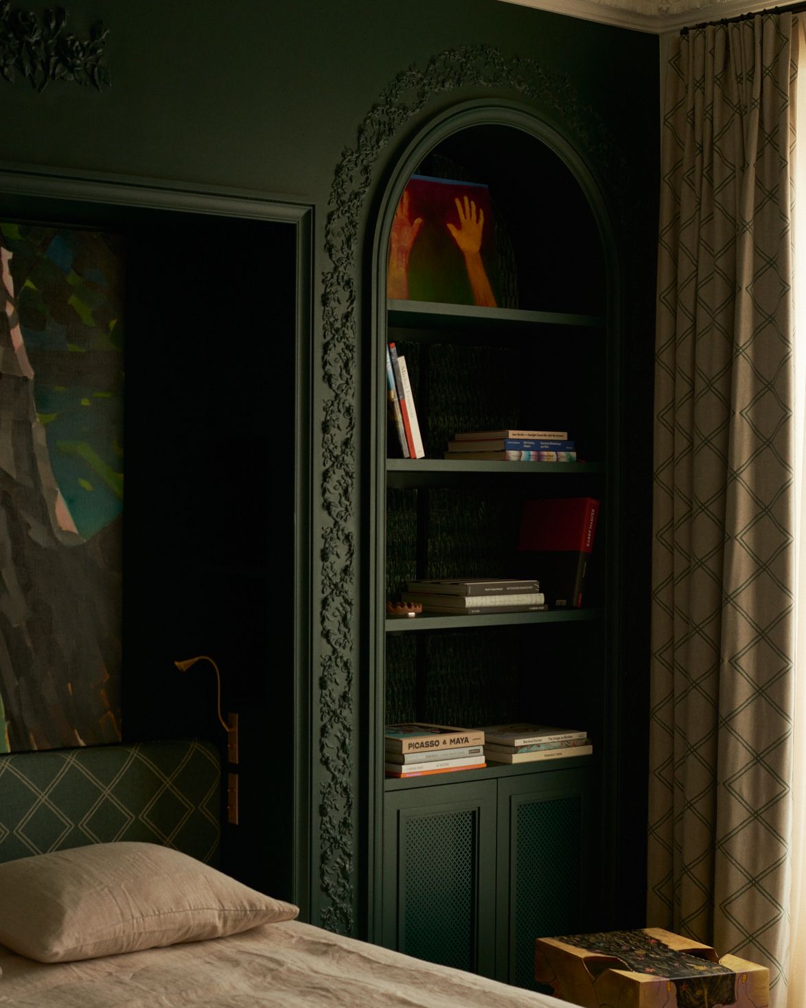 a bedroom with built in storage on side of bed