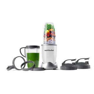 The nutribullet Pro Blender with lids and a cup and fruit in the machine