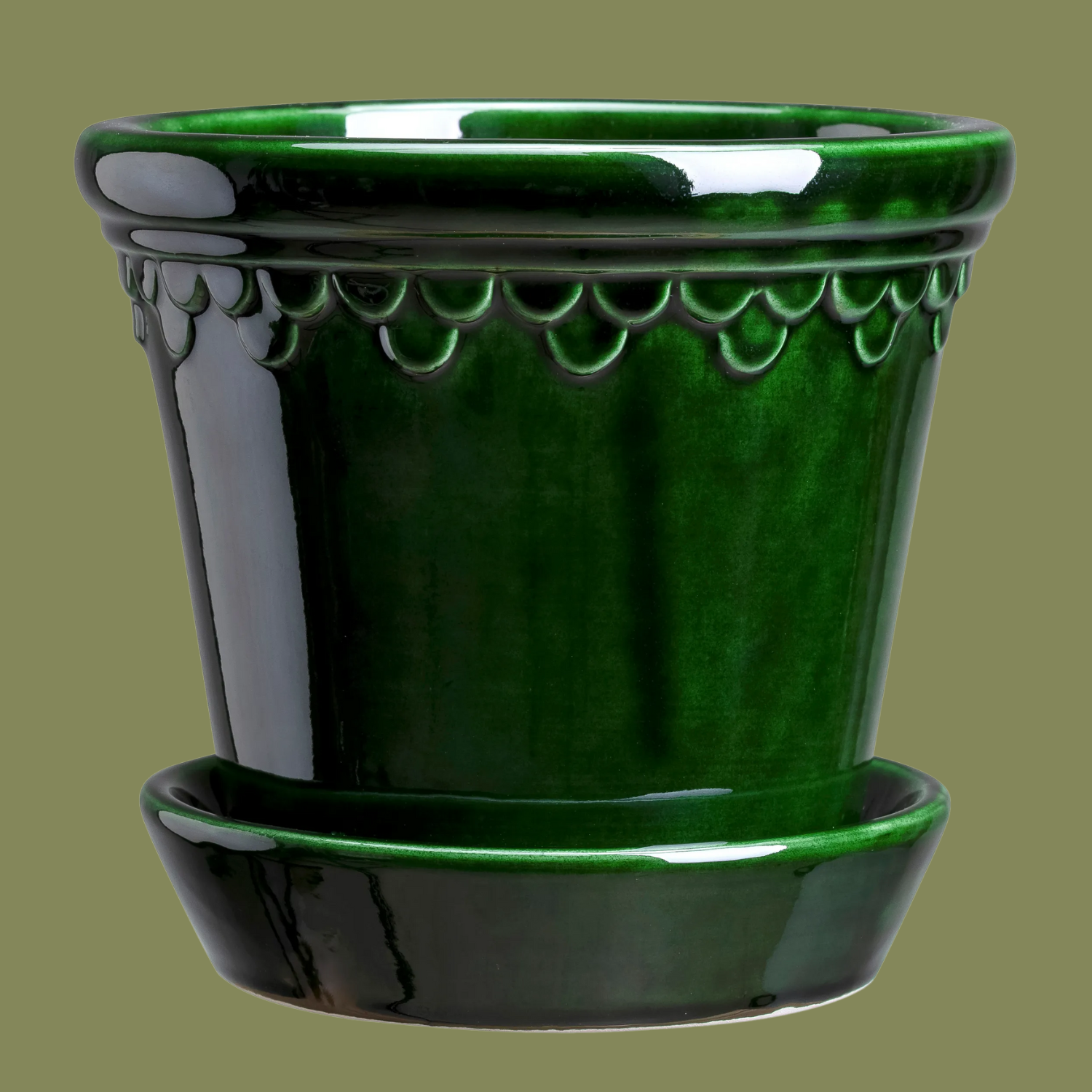 A glossy green pot with a saucer