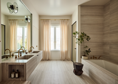 A bathroom clad in travertine