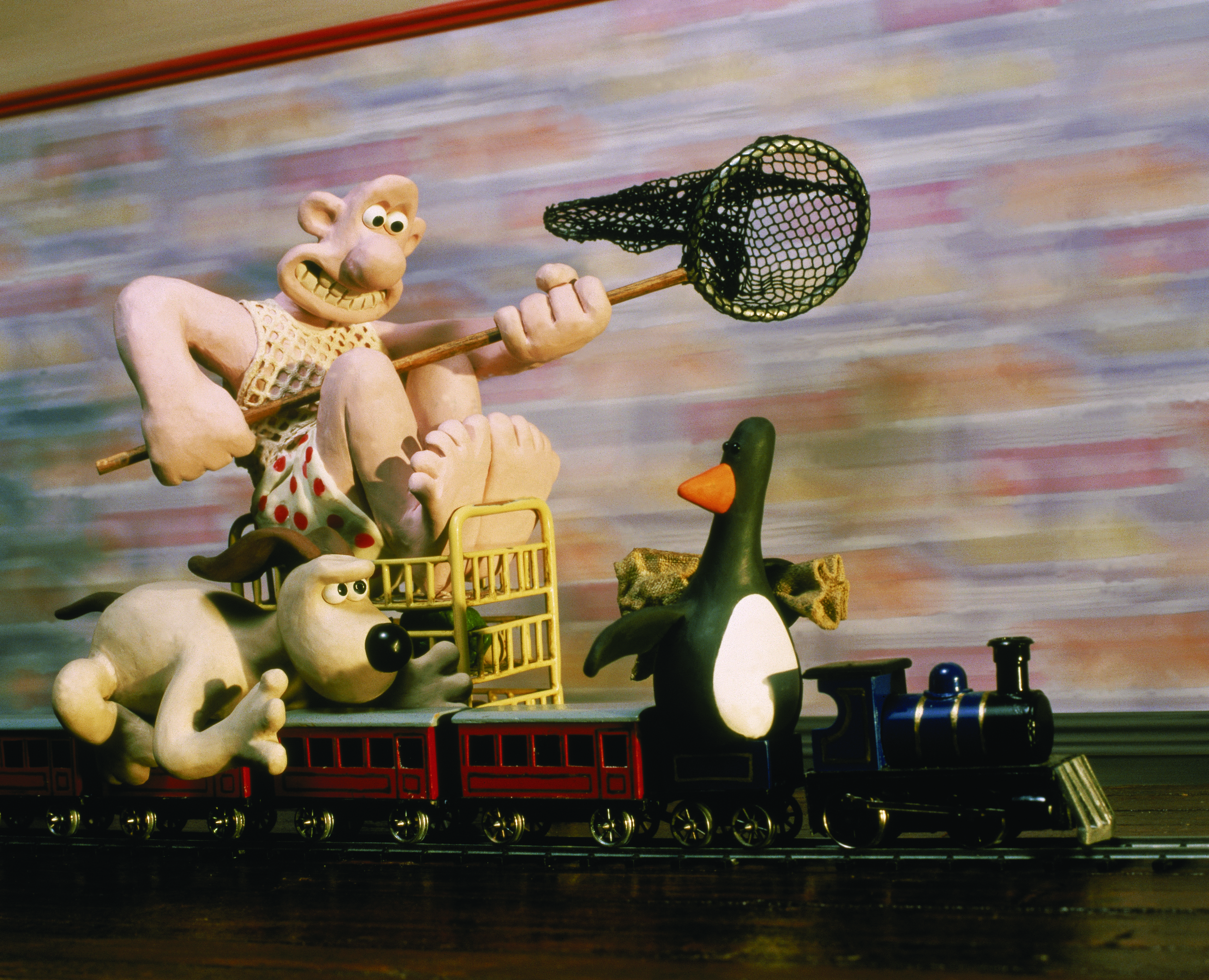 Wallace and Gromit chasing criminal mastermind Feathers McGraw in The Wrong Trousers (1993) &amp;copy; and TM Aardman Animations LTD, Wallace &amp;amp; Gromit LTD
