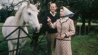 Queen Elizabeth II and Prince Philip visit a farm on the Balmoral estate in Scotland, during their Silver Wedding anniversary year