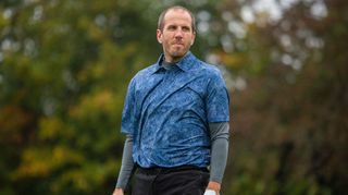 A man wears a Farah Starkey Print Polo Shirt