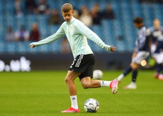 Jay Stansfield of Fulham warms up prior to the Sky Bet Championship match between Millwall and Fulham at The Den on August 17, 2021 in London, England.