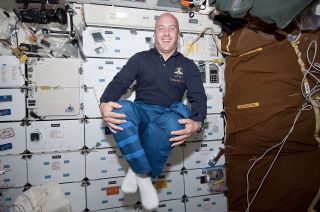Garrett Reisman, as seen in 2010 taking advantage of the zero-g environment on the middeck of the space shuttle Atlantis.