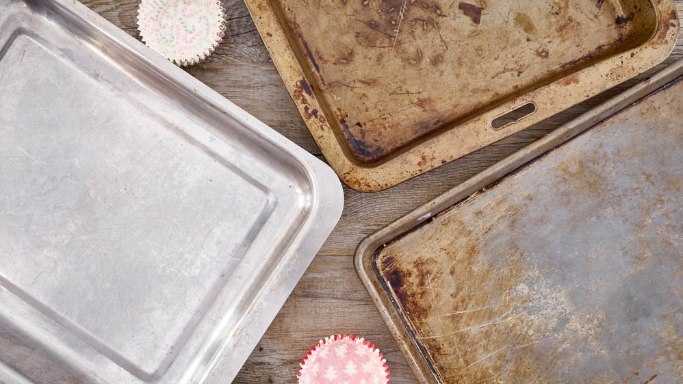 Several baking sheets on table
