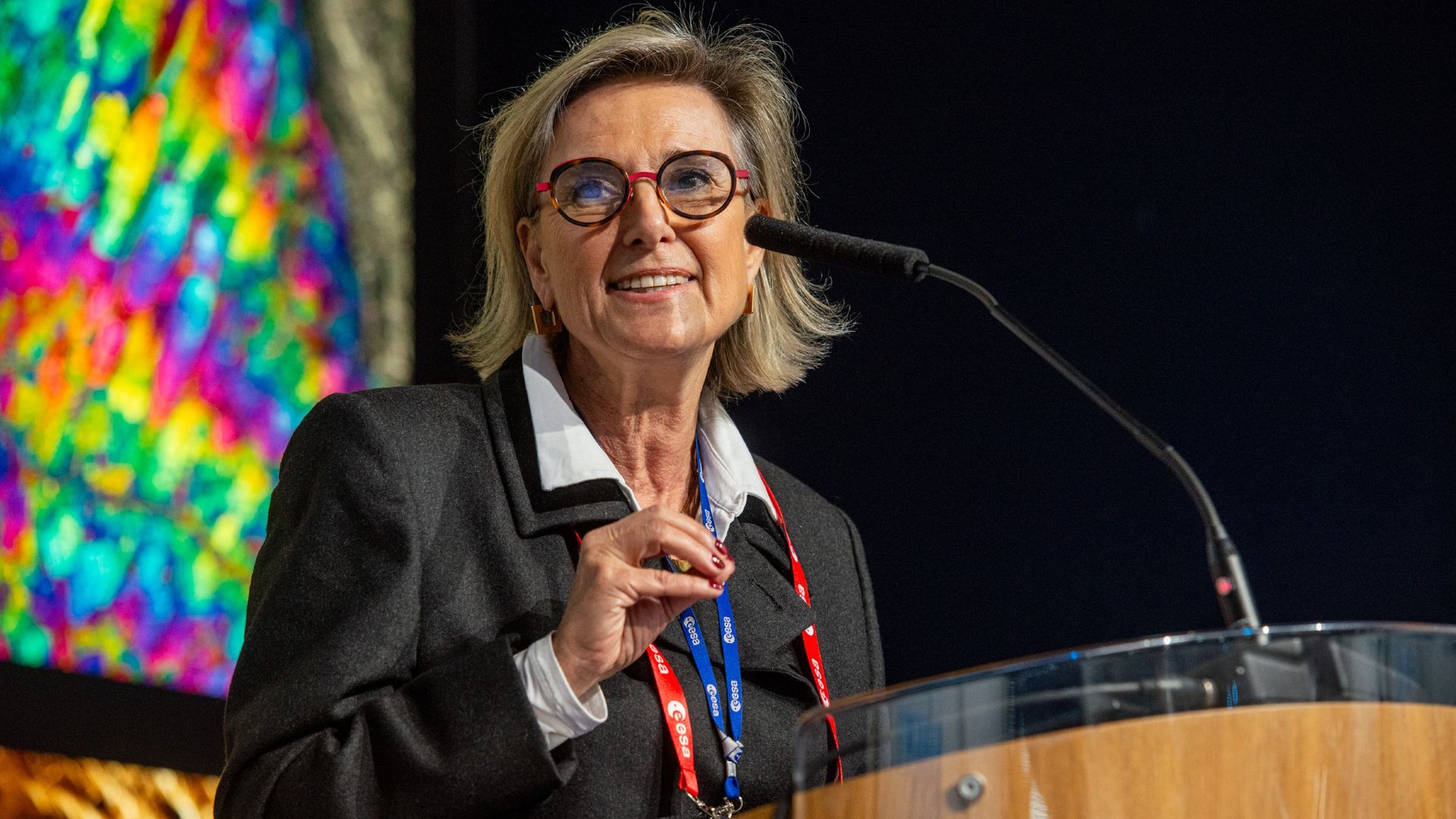 A photo of Simonetta Chelli speaking at a podium