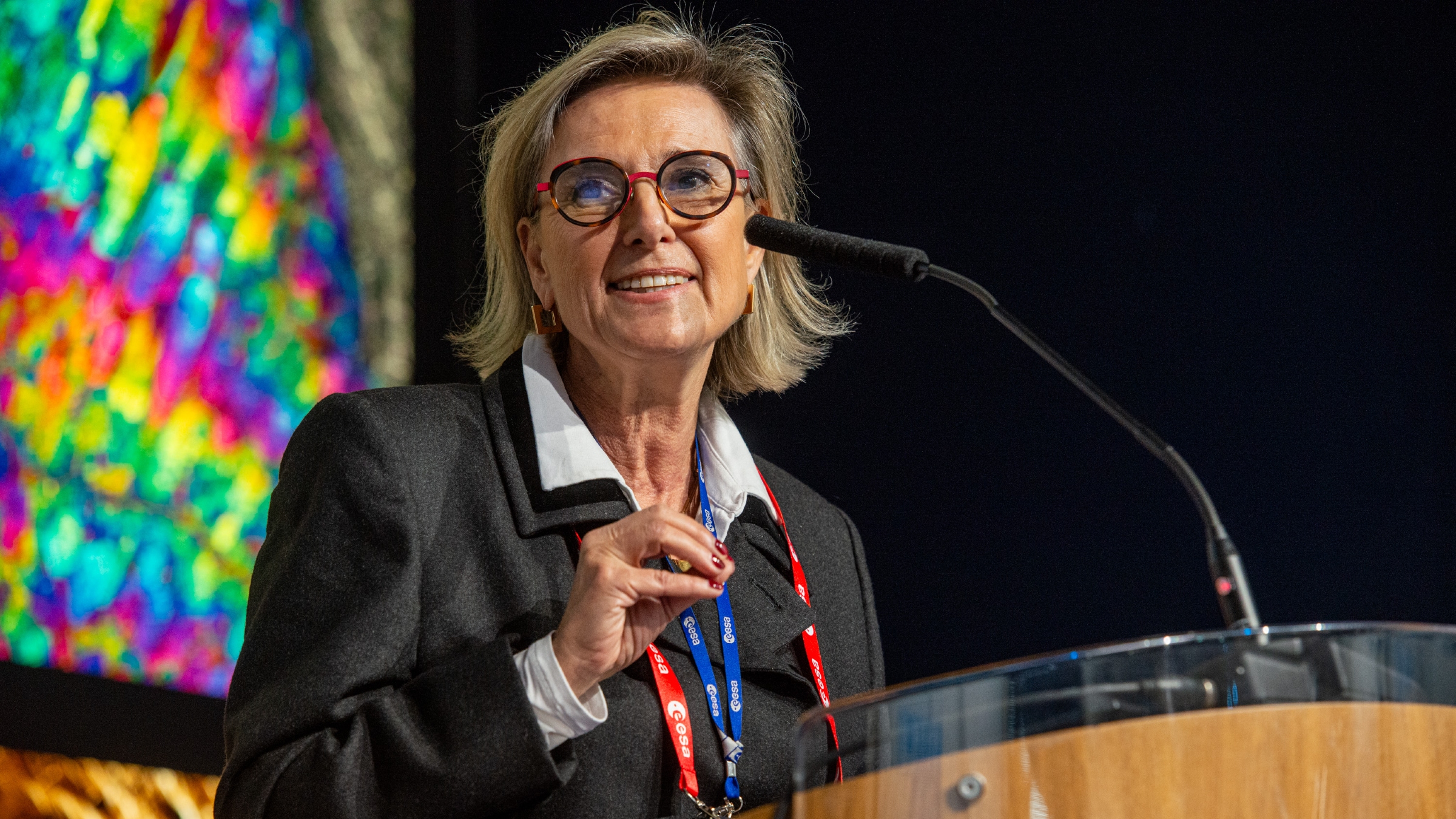 A photo of Simonetta Chelli speaking at a podium