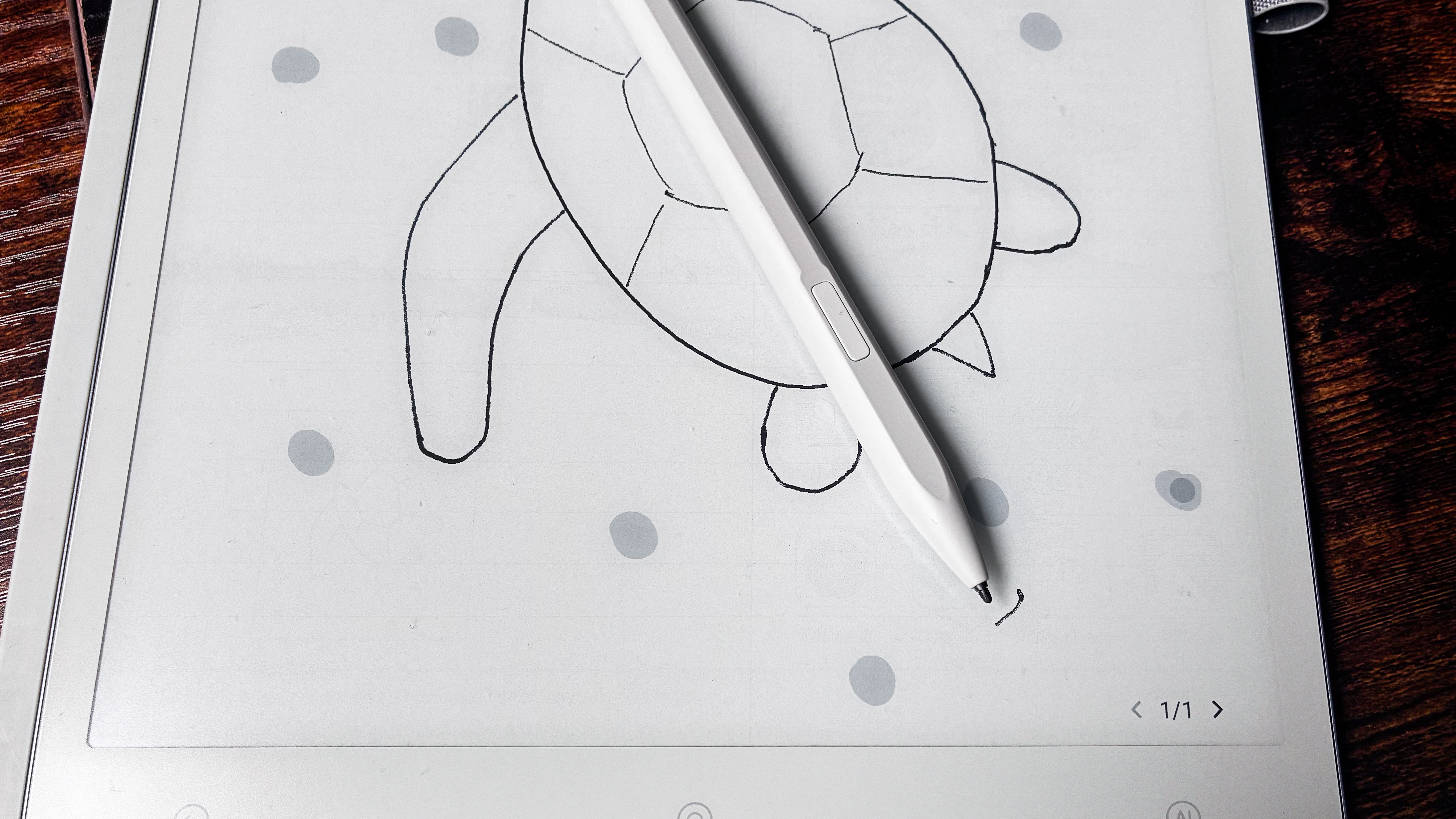 AiPaper Gen2.5 Stylus Pen lying on a drawing on the ViWoods AiPaper with its button on top