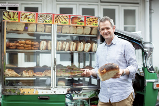 Alexander Armstrong in Sri Lanka: the presenter posing with local bread