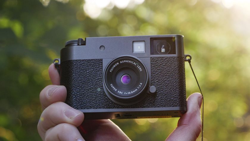 Fujifilm X half camera in the hand at golden hour