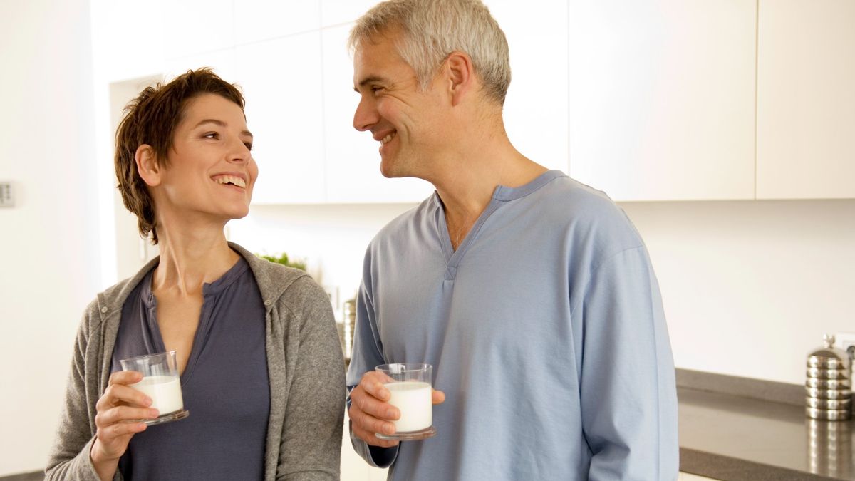 Middle aged couple drinking milk