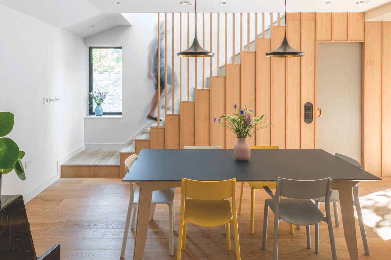 timber staircase with modern dining area